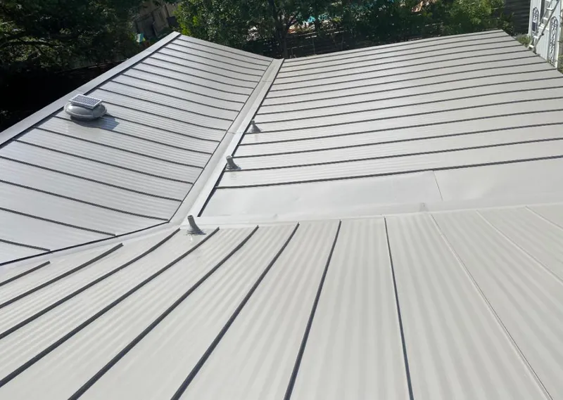 Solar attic fan installed on a metal roof for Roof Ventilation in Hanover
